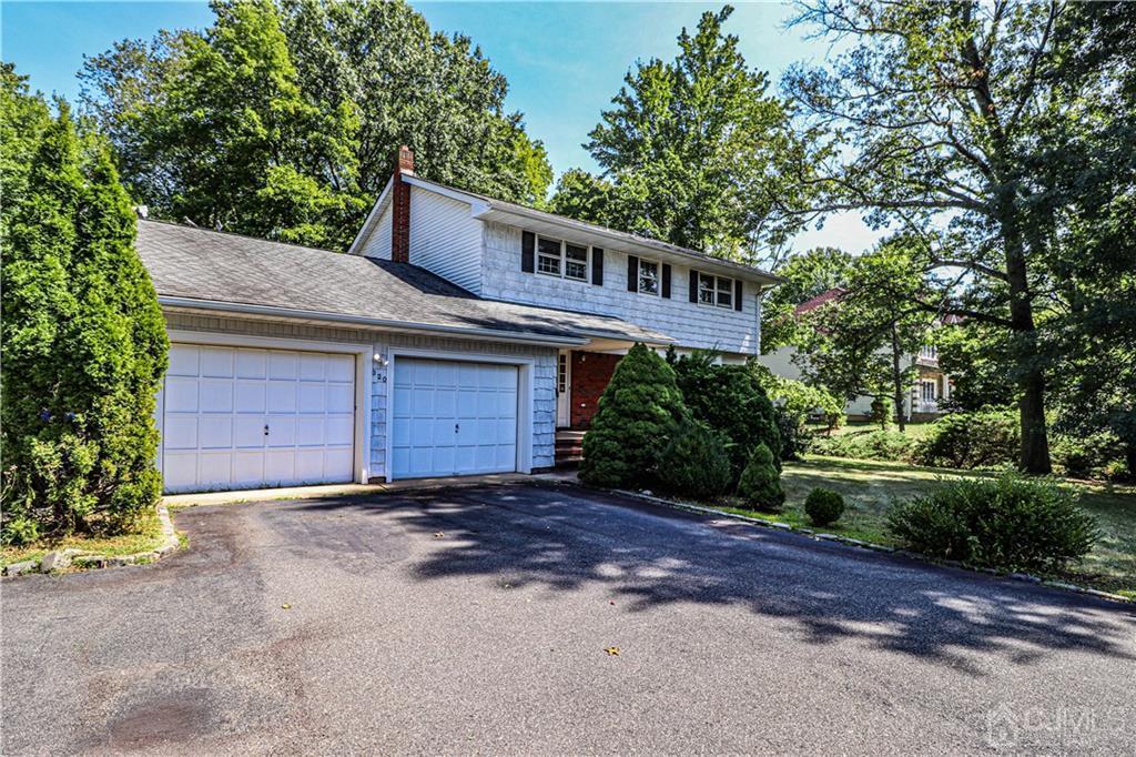 320 Plainfield Road Edison, NJ 08820 - Photo 3 of 50 a front view of a house with a garden