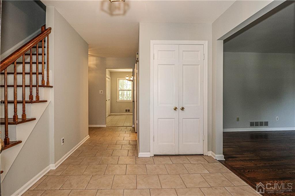 320 Plainfield Road Edison, NJ 08820 - Photo 5 of 50 a view of a hallway with wooden floor and staircase