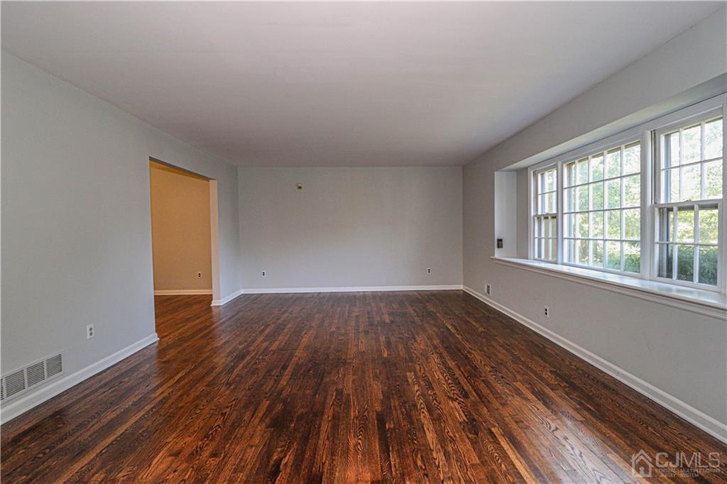320 Plainfield Road Edison, NJ 08820 - Photo 8 of 50 wooden floor in an empty room with a window