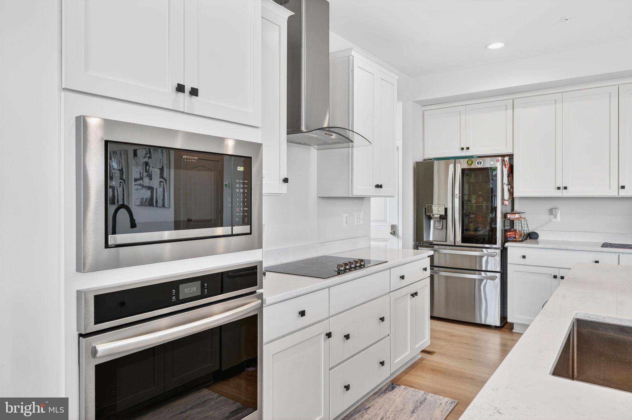 30 Range Road North East, MD 21901 - Photo 18 of 73 a kitchen with white cabinets and stainless steel appliances