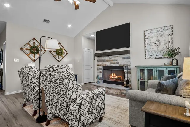 a living room with furniture and a fireplace