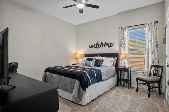 a bedroom with bed and window