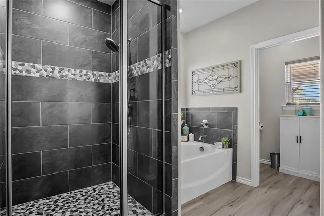 a bathroom with a granite countertop sink vanity and mirror