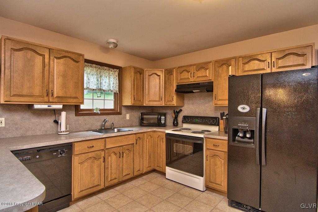 251 Devils Hole Road Cresco, PA 18326 - Photo 11 of 35 a kitchen with a sink cabinets and appliances