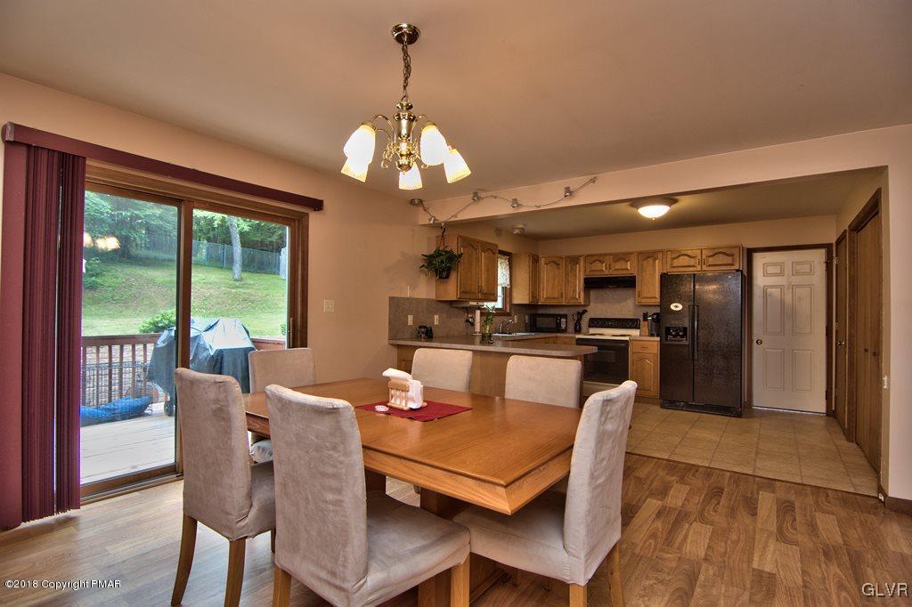 251 Devils Hole Road Cresco, PA 18326 - Photo 15 of 35 a view of a dining room with furniture window and wooden floor
