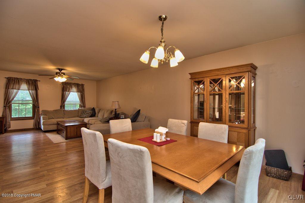 251 Devils Hole Road Cresco, PA 18326 - Photo 17 of 35 a view of a dining room with furniture window and wooden floor