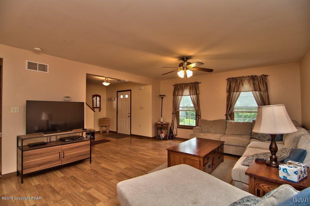251 Devils Hole Road Cresco, PA 18326 - Photo 20 of 35 a living room with furniture and a flat screen tv
