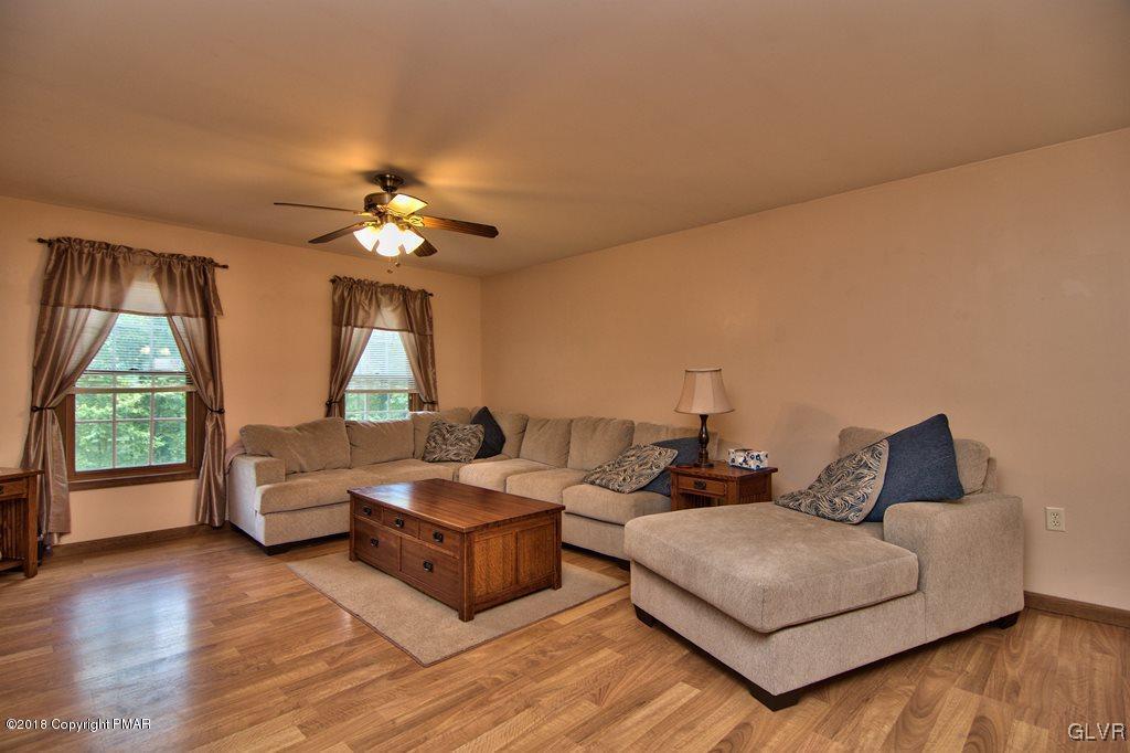 251 Devils Hole Road Cresco, PA 18326 - Photo 21 of 35 a living room with furniture and a large window