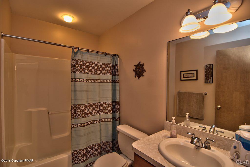 251 Devils Hole Road Cresco, PA 18326 - Photo 28 of 35 a bathroom with a sink a toilet and shower