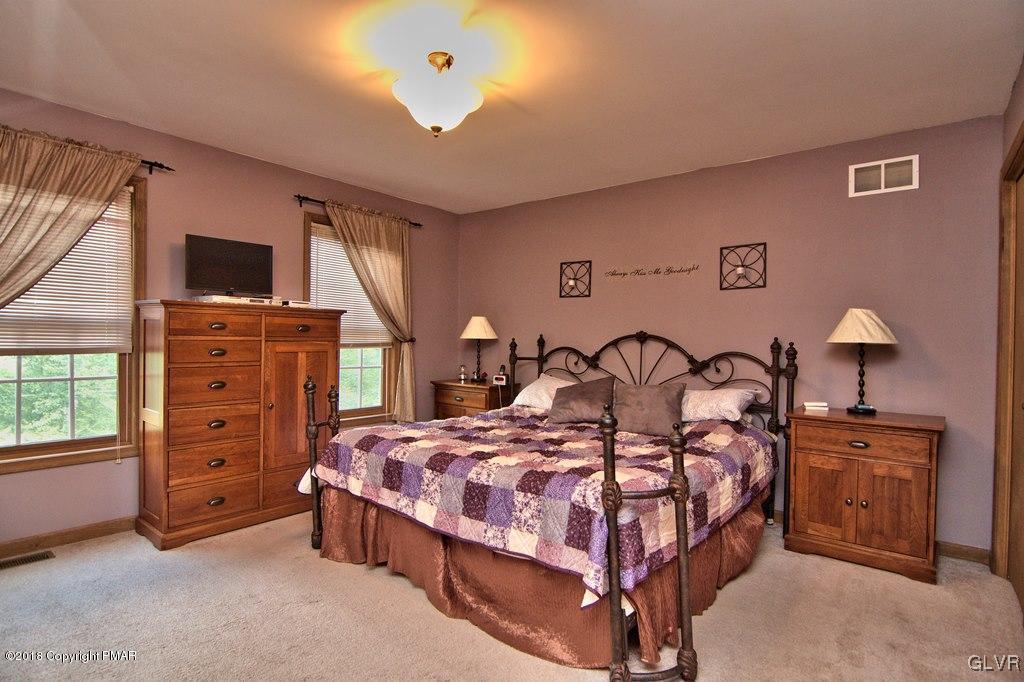 251 Devils Hole Road Cresco, PA 18326 - Photo 35 of 35 a bedroom with a bed and with furniture