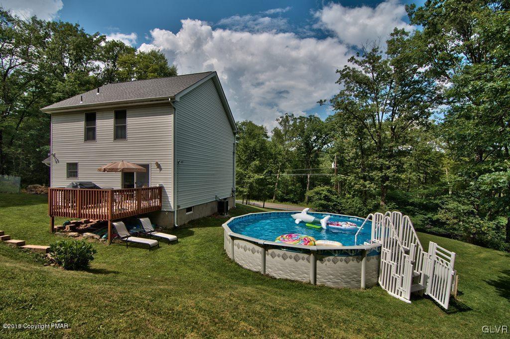 251 Devils Hole Road Cresco, PA 18326 - Photo 5 of 35 a backyard of a house with table and chairs