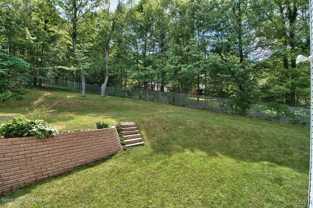 251 Devils Hole Road Cresco, PA 18326 - Photo 7 of 35 a view of a backyard with a garden
