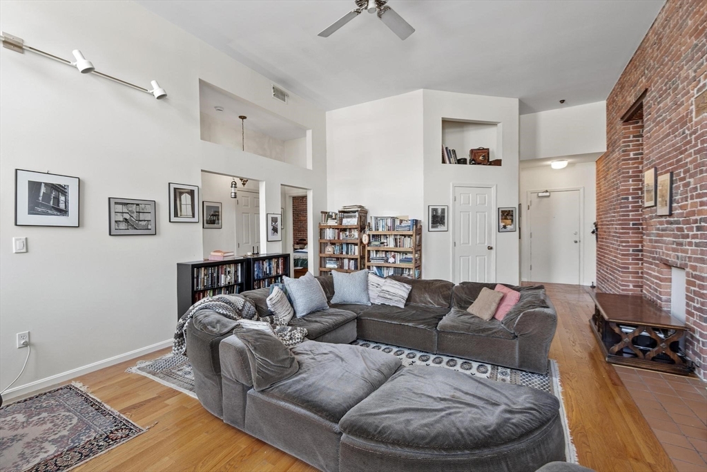 66 Haskell Street, Unit 1N Beverly, MA 01915 - Photo 11 of 27 a living room with furniture and a couch