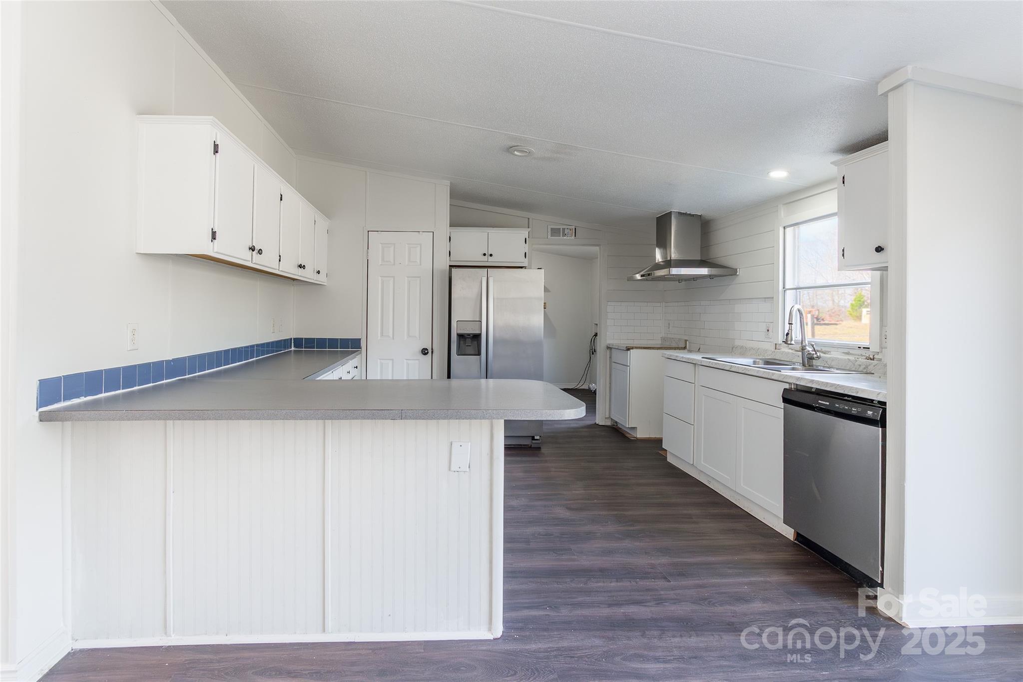 6315 Wingate Hill Road Denver, NC 28037 - Photo 11 of 21 a kitchen with stainless steel appliances kitchen island granite countertop a sink and cabinets