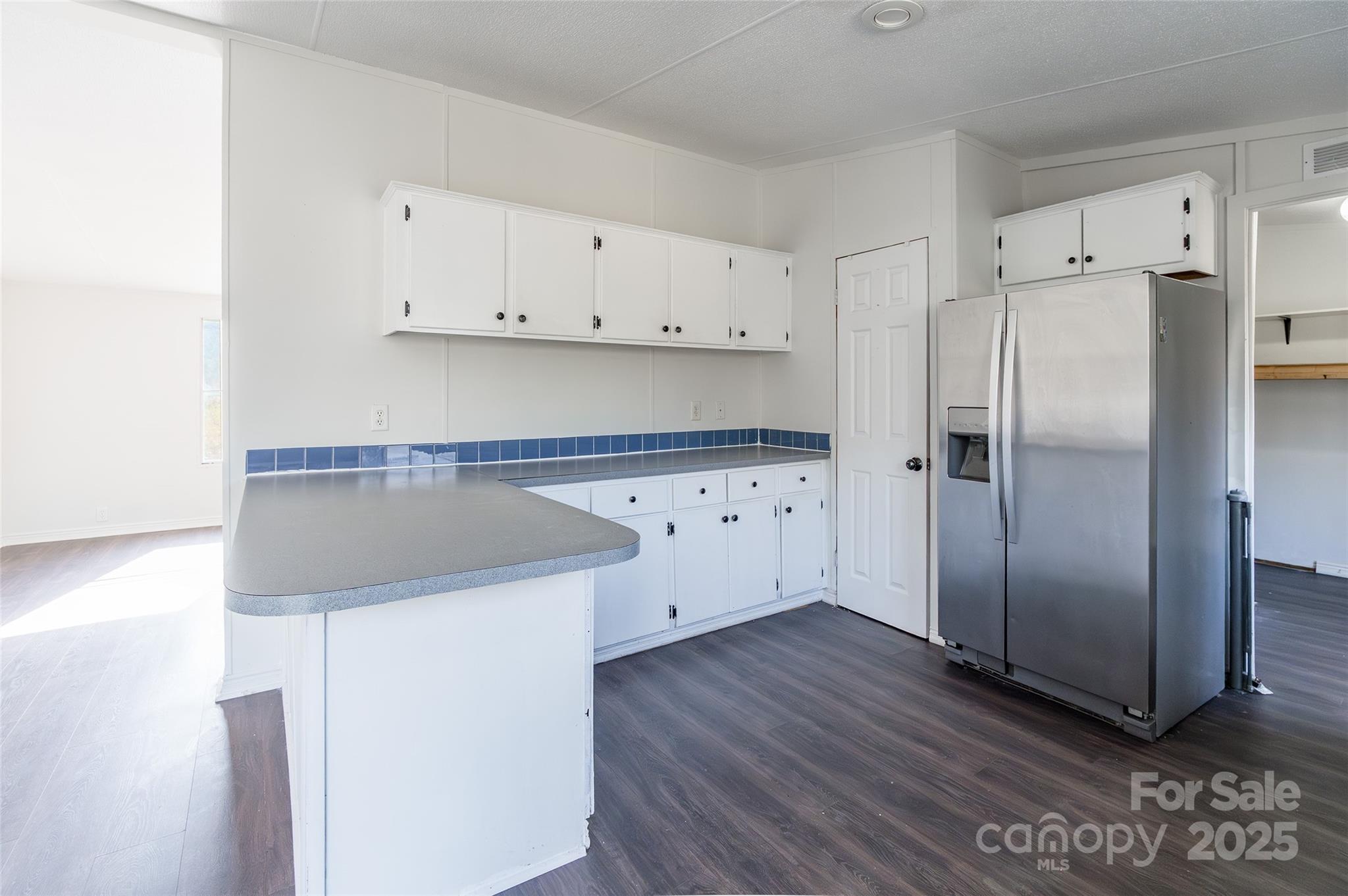 6315 Wingate Hill Road Denver, NC 28037 - Photo 13 of 21 a kitchen with granite countertop a refrigerator and a stove top oven
