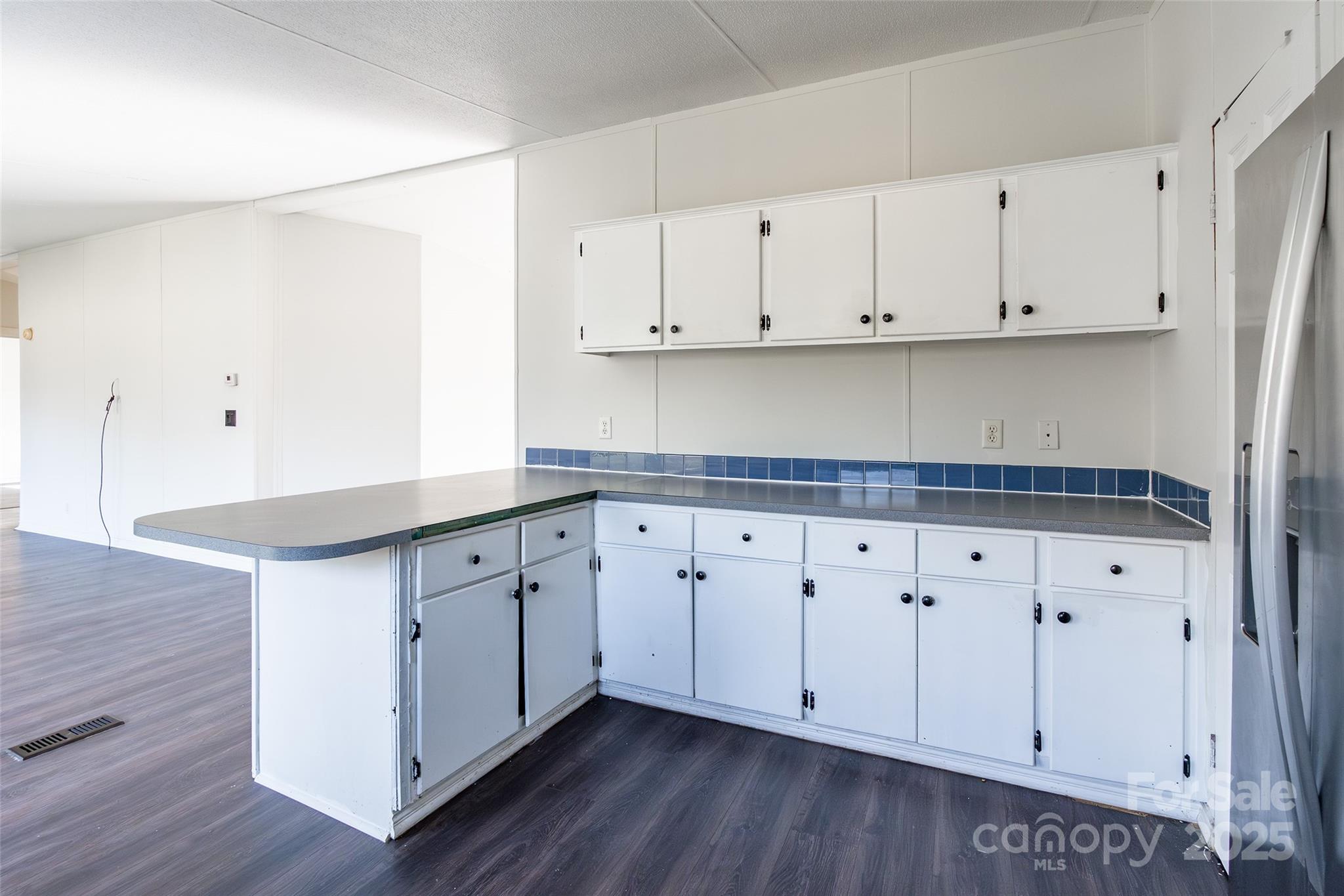 6315 Wingate Hill Road Denver, NC 28037 - Photo 14 of 21 a kitchen with granite countertop white cabinets and a sink