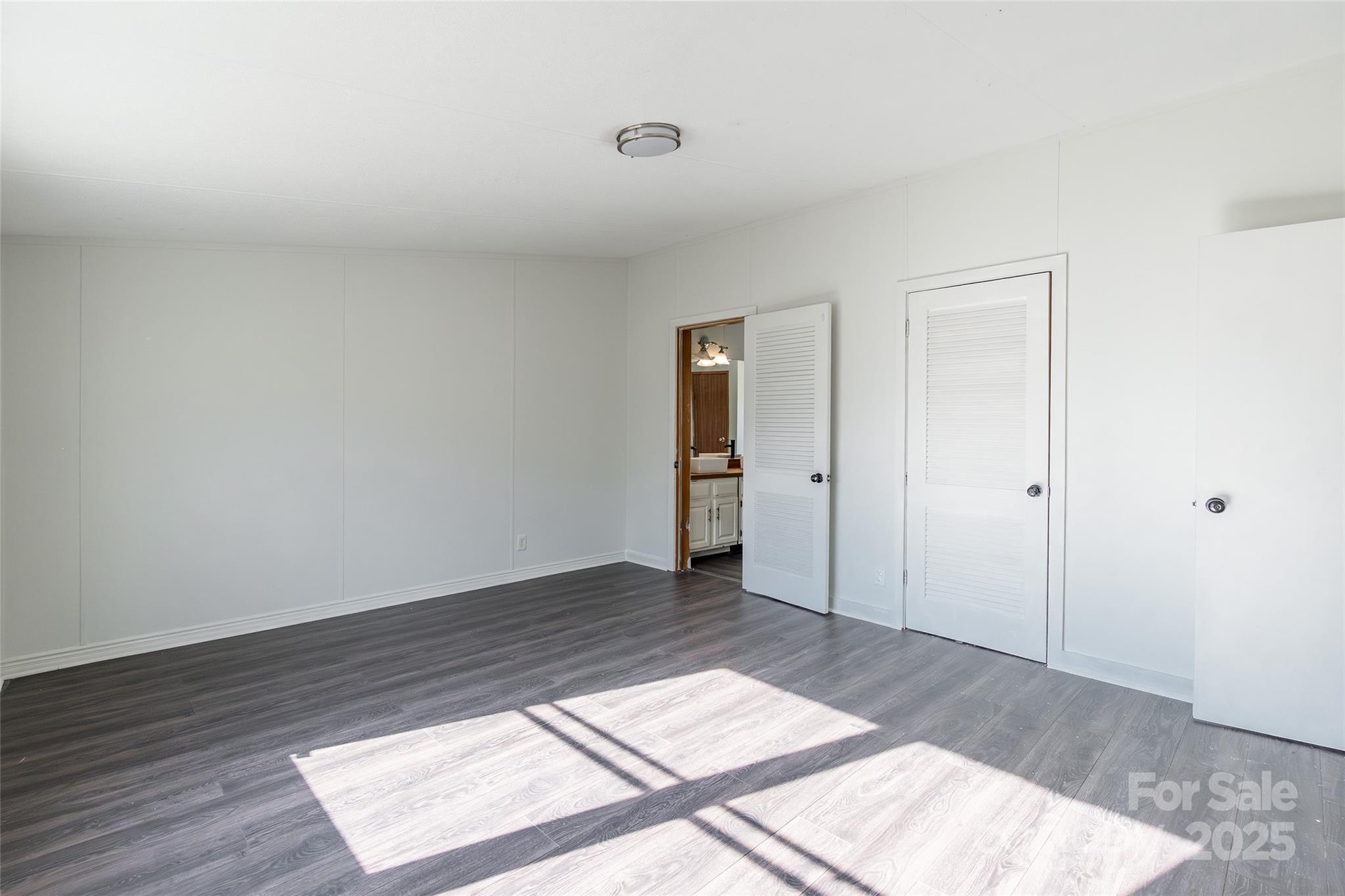 6315 Wingate Hill Road Denver, NC 28037 - Photo 16 of 21 an empty room with wooden floor