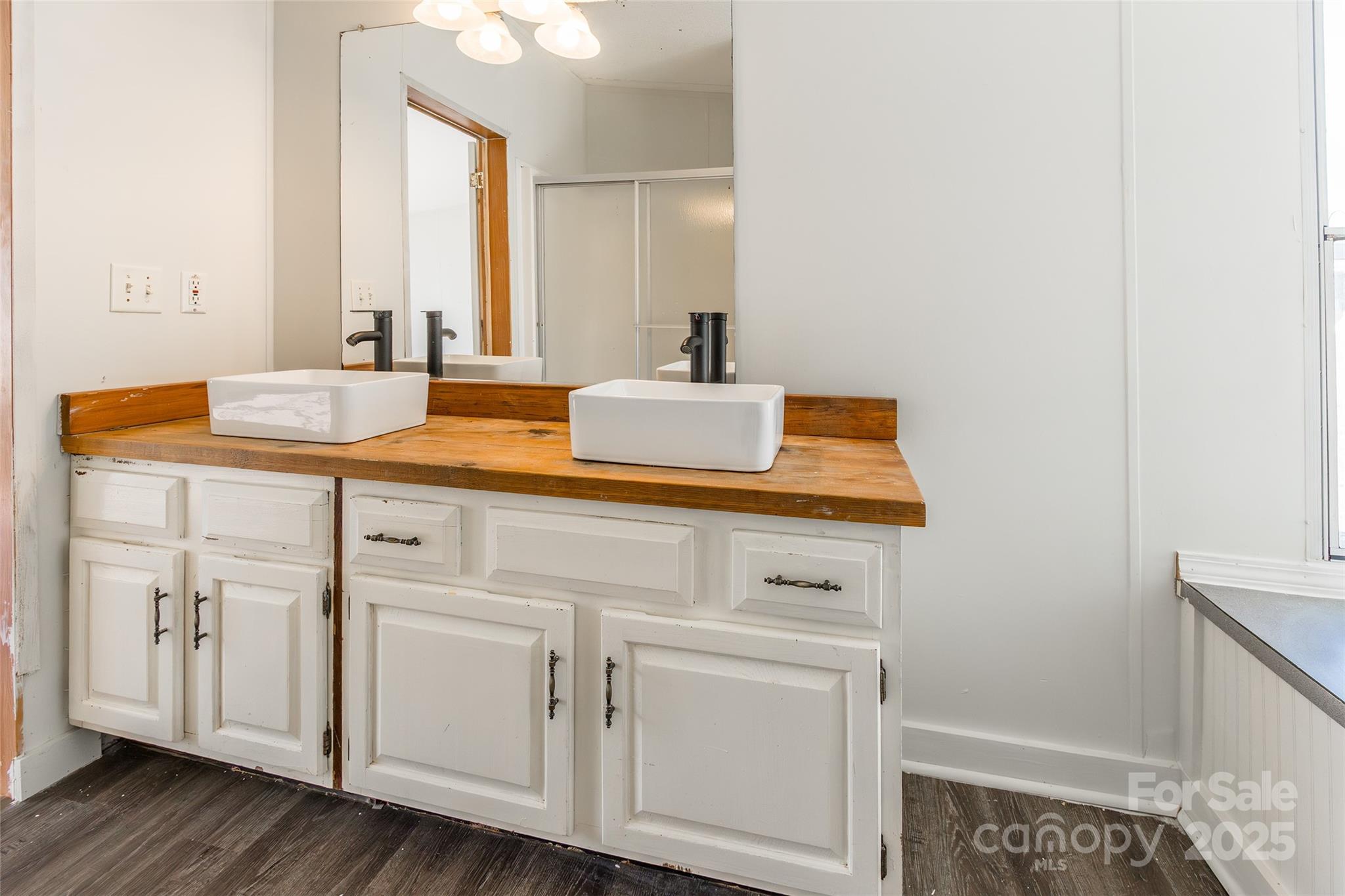 6315 Wingate Hill Road Denver, NC 28037 - Photo 19 of 21 a bathroom with a sink and a mirror