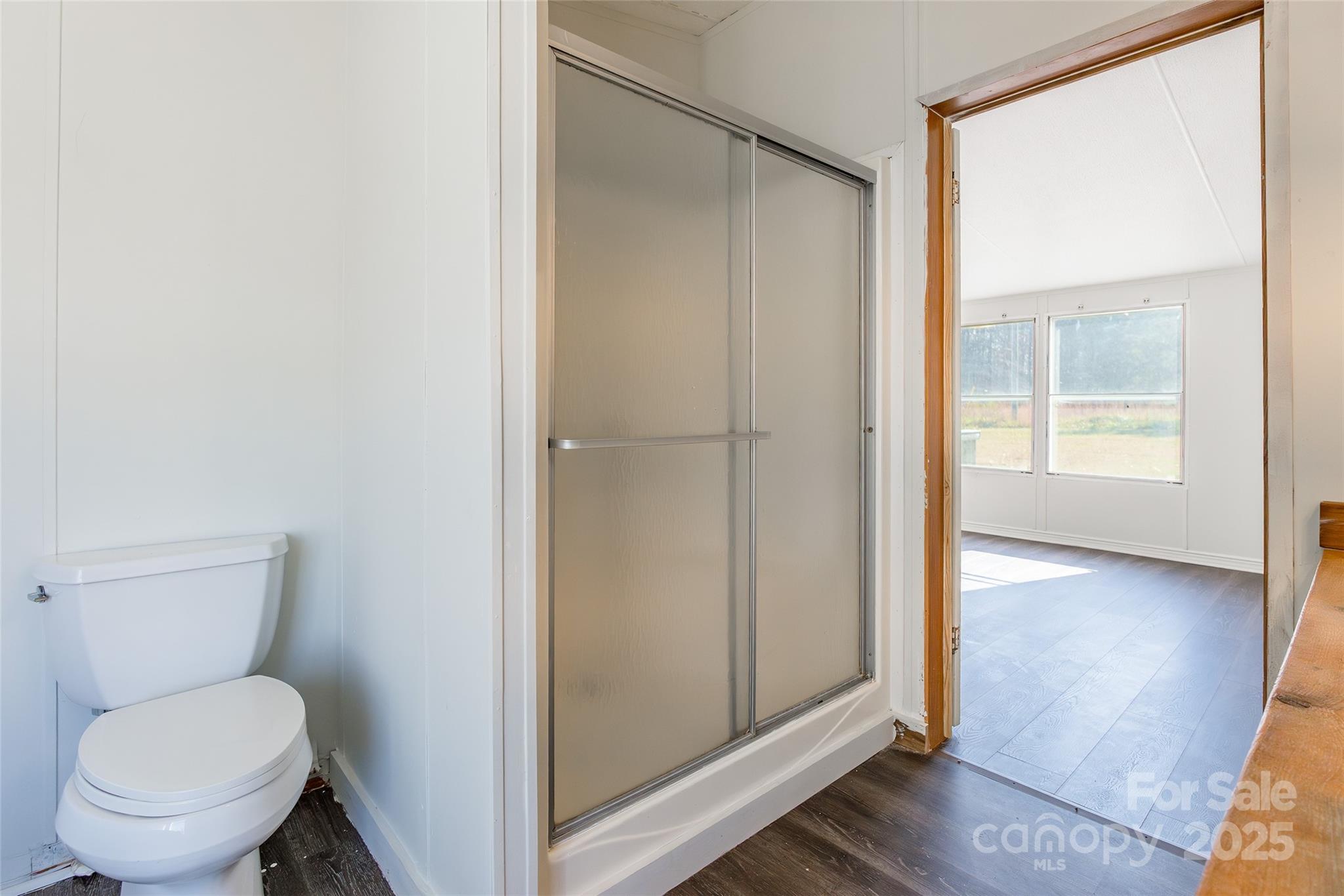 6315 Wingate Hill Road Denver, NC 28037 - Photo 20 of 21 a white toilet sitting next to a bathroom sink