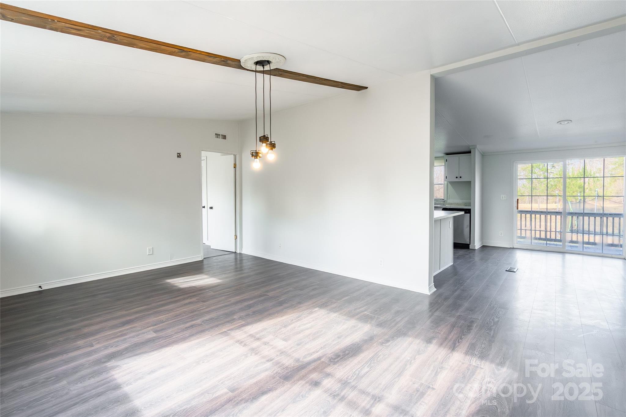 6315 Wingate Hill Road Denver, NC 28037 - Photo 6 of 21 an empty room with wooden floor and windows