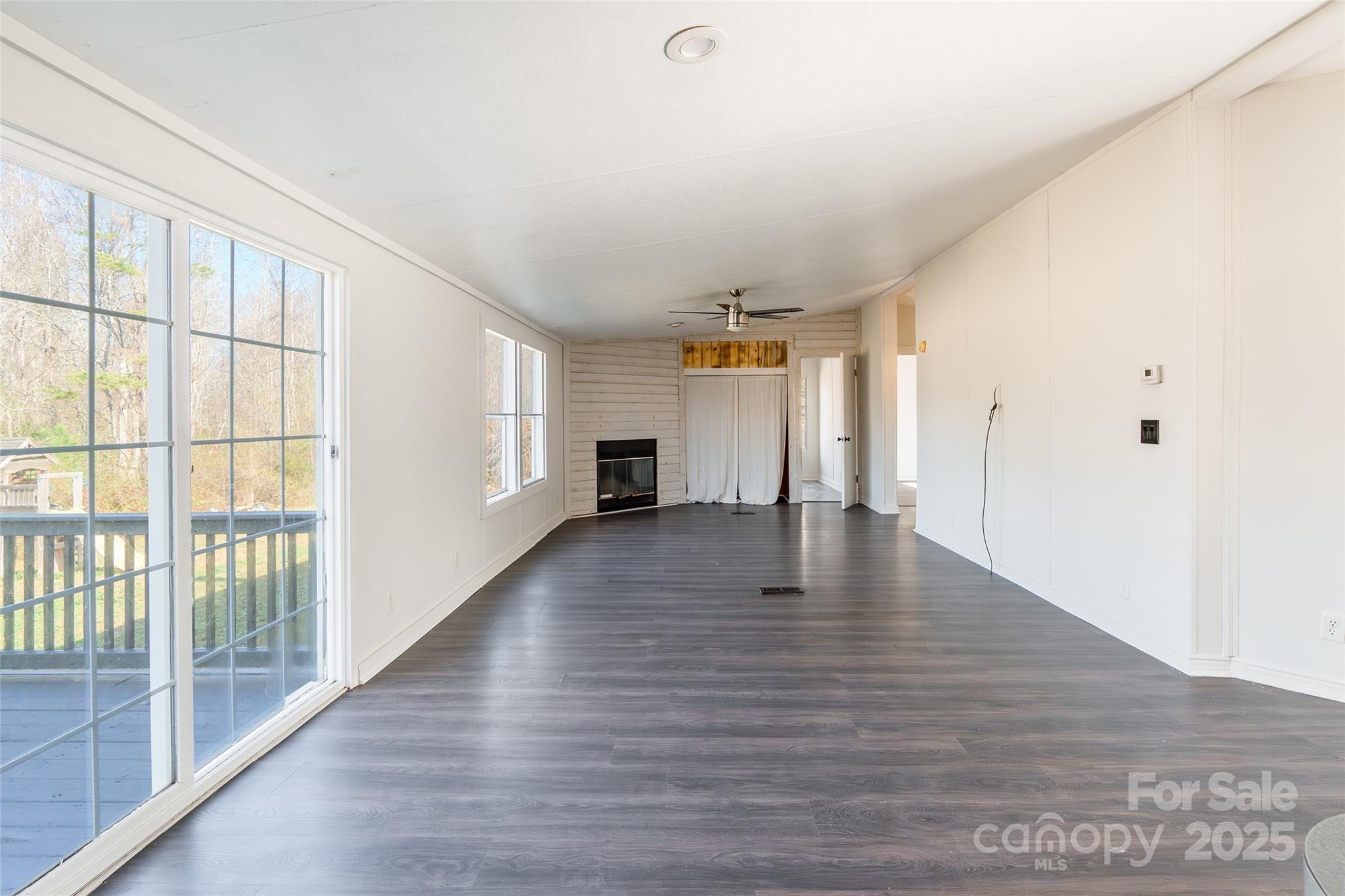 6315 Wingate Hill Road Denver, NC 28037 - Photo 7 of 21 a view of an empty room with wooden floor and a window
