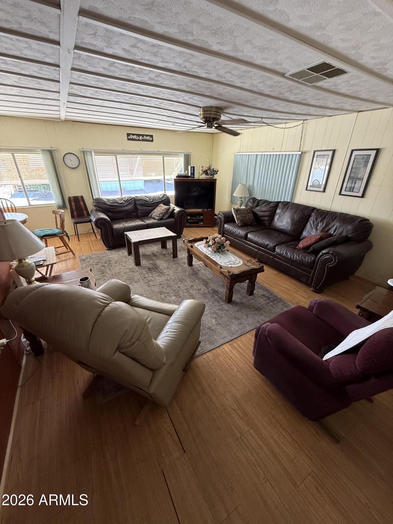 9501 East Broadway Road, Unit 164 Mesa, AZ 85208 - Photo 14 of 27 a living room with furniture window and a table