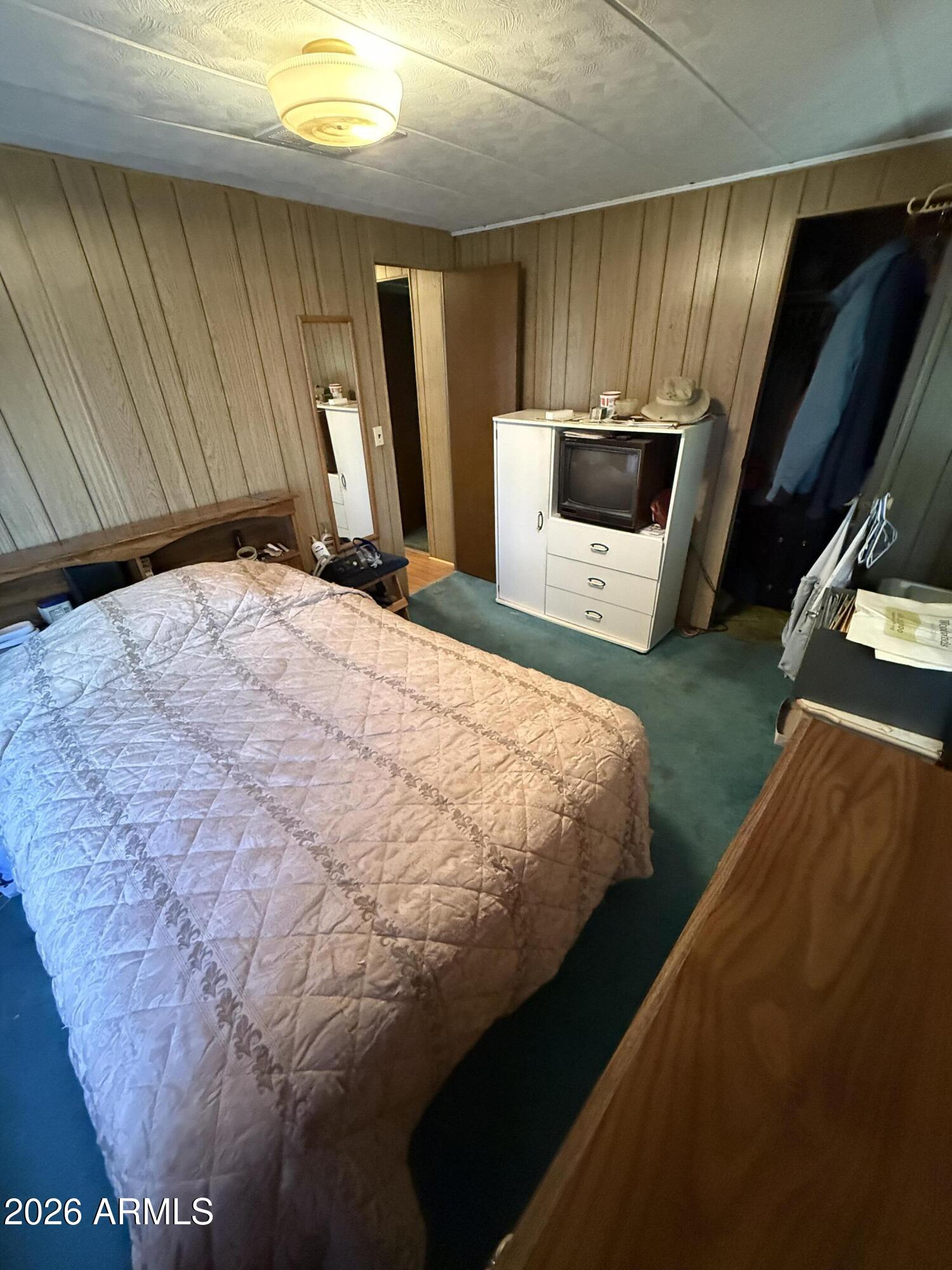 9501 East Broadway Road, Unit 164 Mesa, AZ 85208 - Photo 16 of 27 a bed sitting in a kitchen next to a window