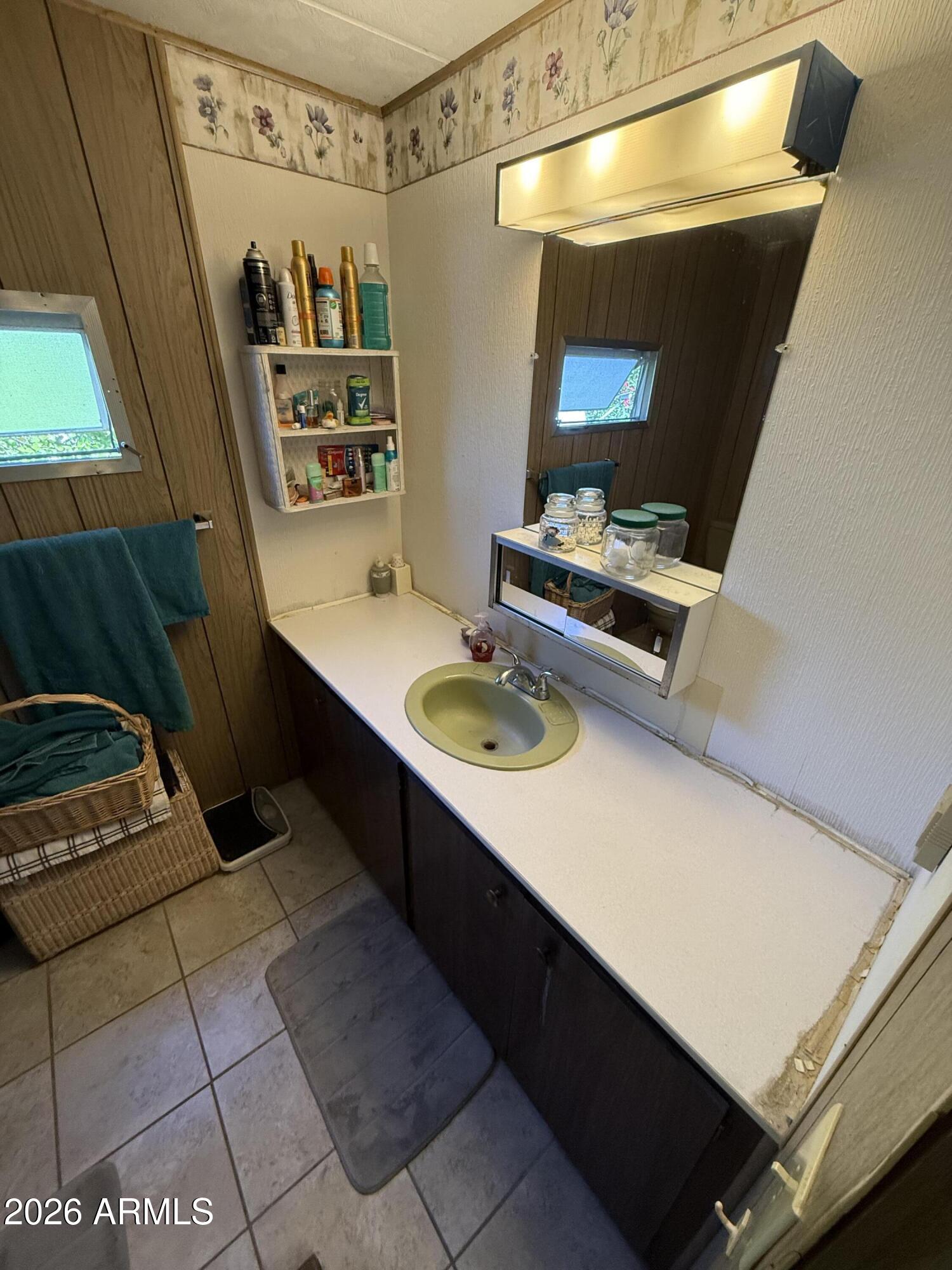 9501 East Broadway Road, Unit 164 Mesa, AZ 85208 - Photo 19 of 27 a bathroom with a sink and a mirror