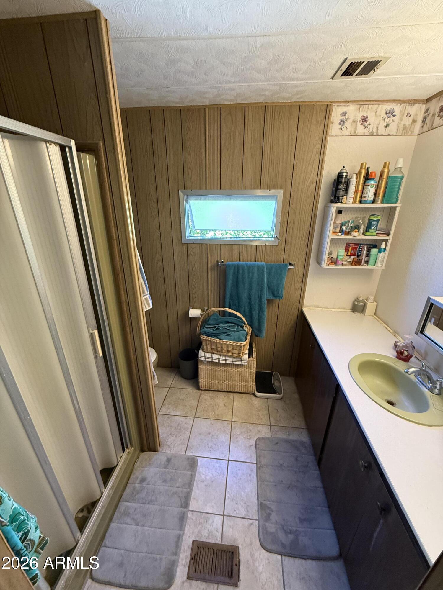 9501 East Broadway Road, Unit 164 Mesa, AZ 85208 - Photo 20 of 27 a bathroom with a sink a toilet and shower