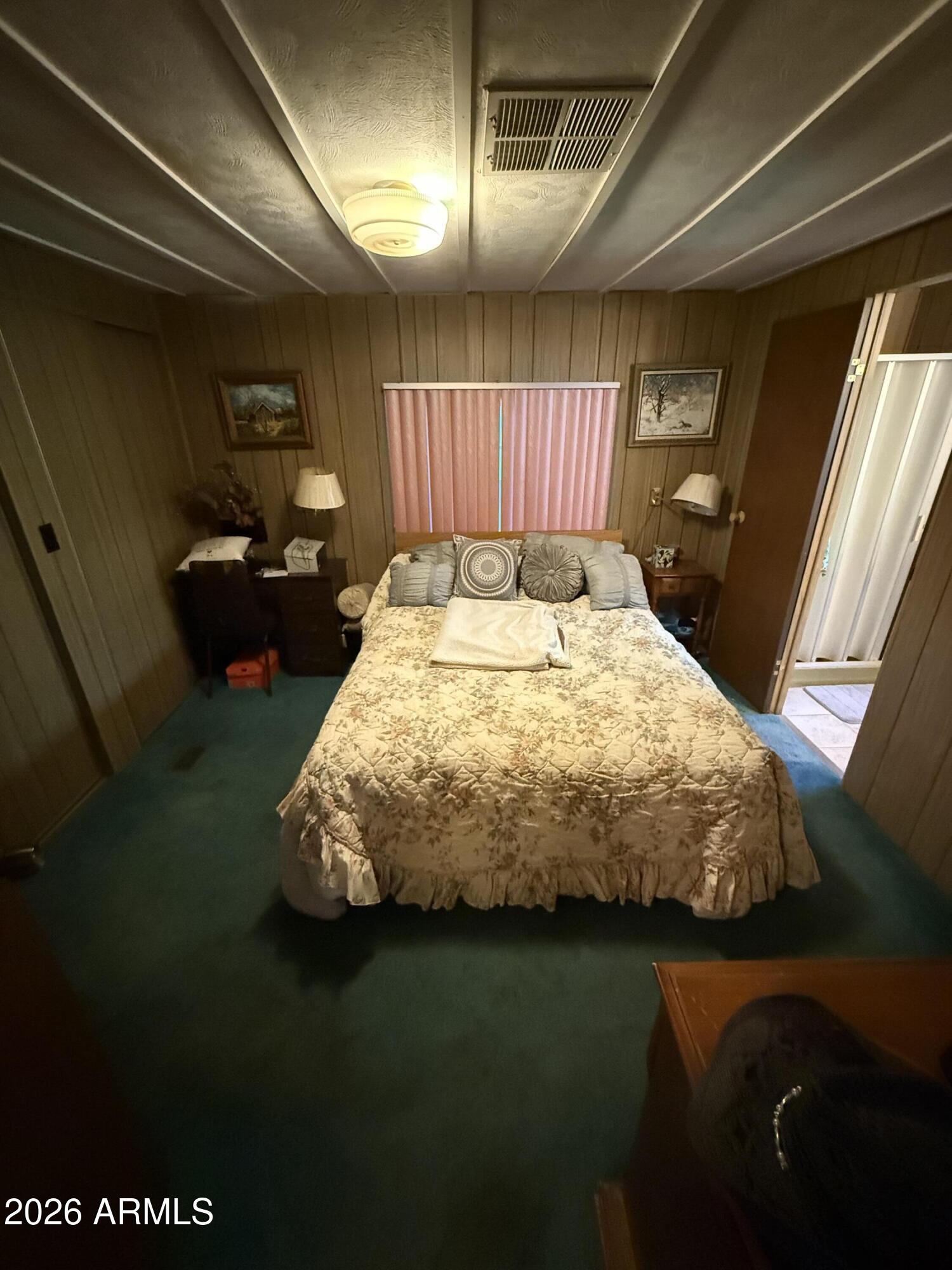 9501 East Broadway Road, Unit 164 Mesa, AZ 85208 - Photo 22 of 27 a bed sitting in a room next to a window