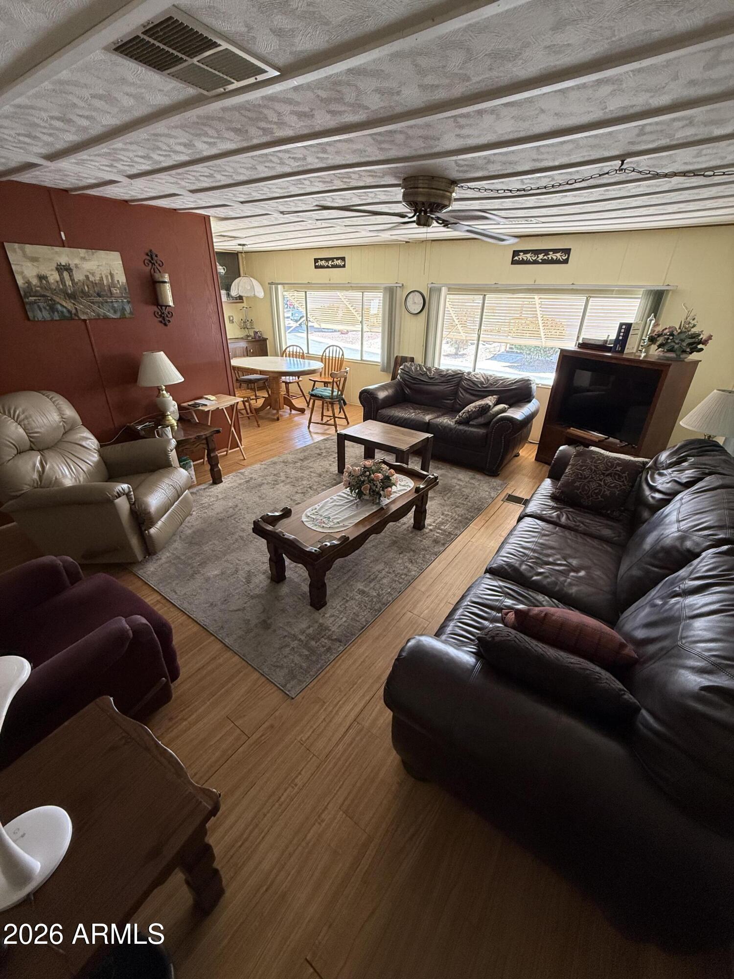 9501 East Broadway Road, Unit 164 Mesa, AZ 85208 - Photo 3 of 27 a living room with furniture and a large window