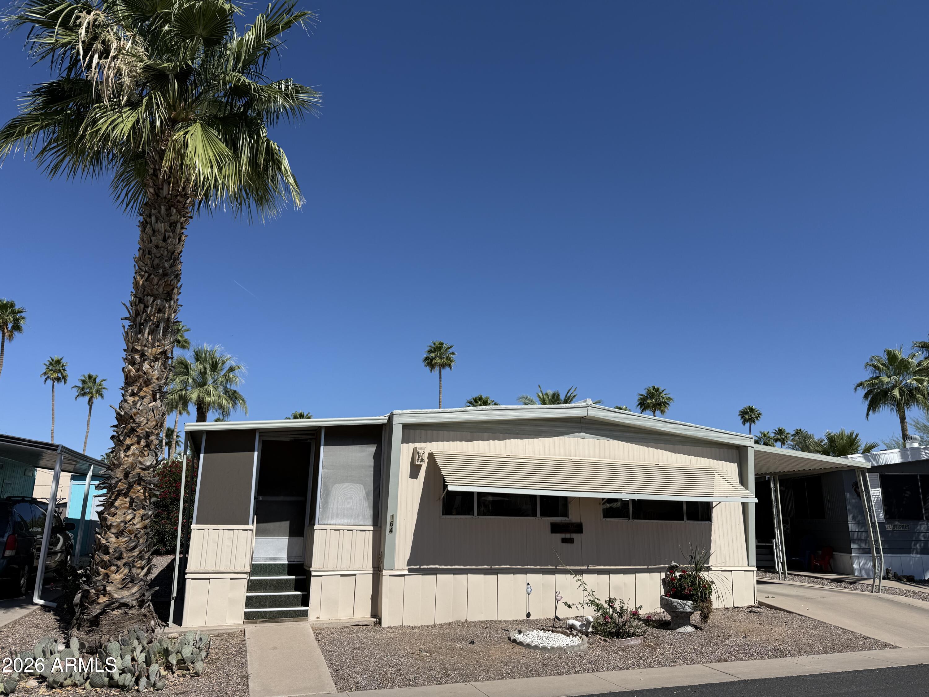 9501 East Broadway Road, Unit 164 Mesa, AZ 85208 - Photo 6 of 27 a view of a house with a street