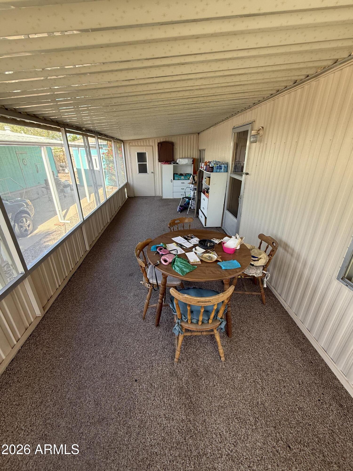 9501 East Broadway Road, Unit 164 Mesa, AZ 85208 - Photo 7 of 27 a outdoor dining space with furniture and outdoor view