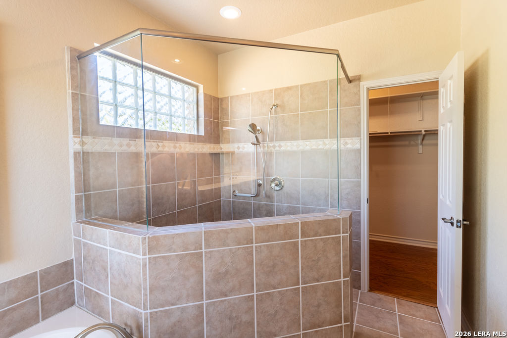 198 Echo Falls Road Comfort, TX 78013 - Photo 17 of 28 a bathroom with a bathtub and shower