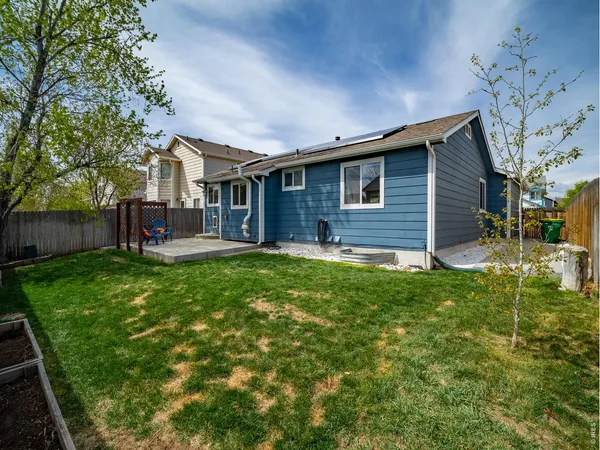 a front view of house with yard and outdoor seating