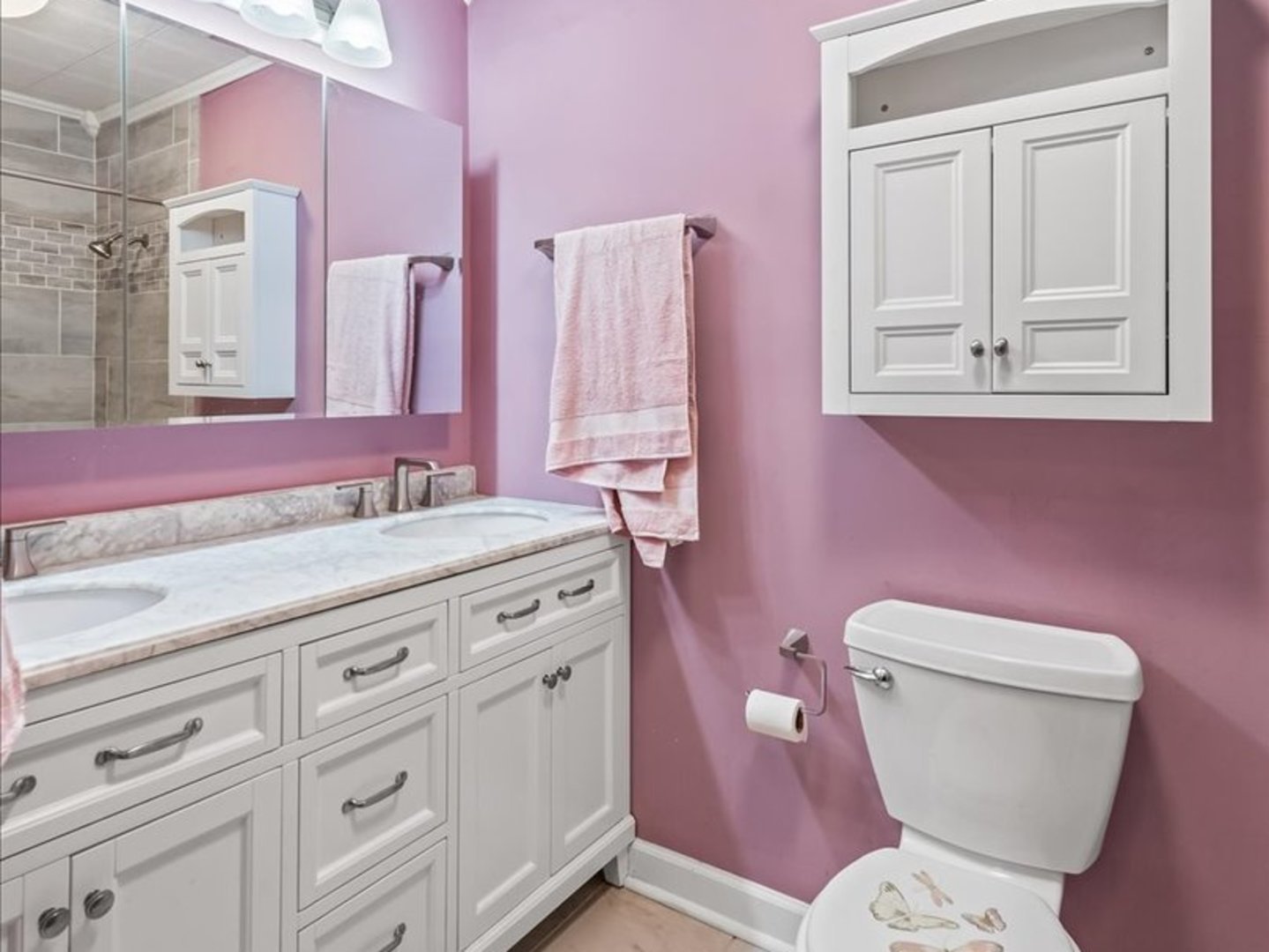 195 Washington Boulevard Hoffman Estates, IL 60169 - Photo 16 of 26 a bathroom with a granite countertop toilet sink and mirror