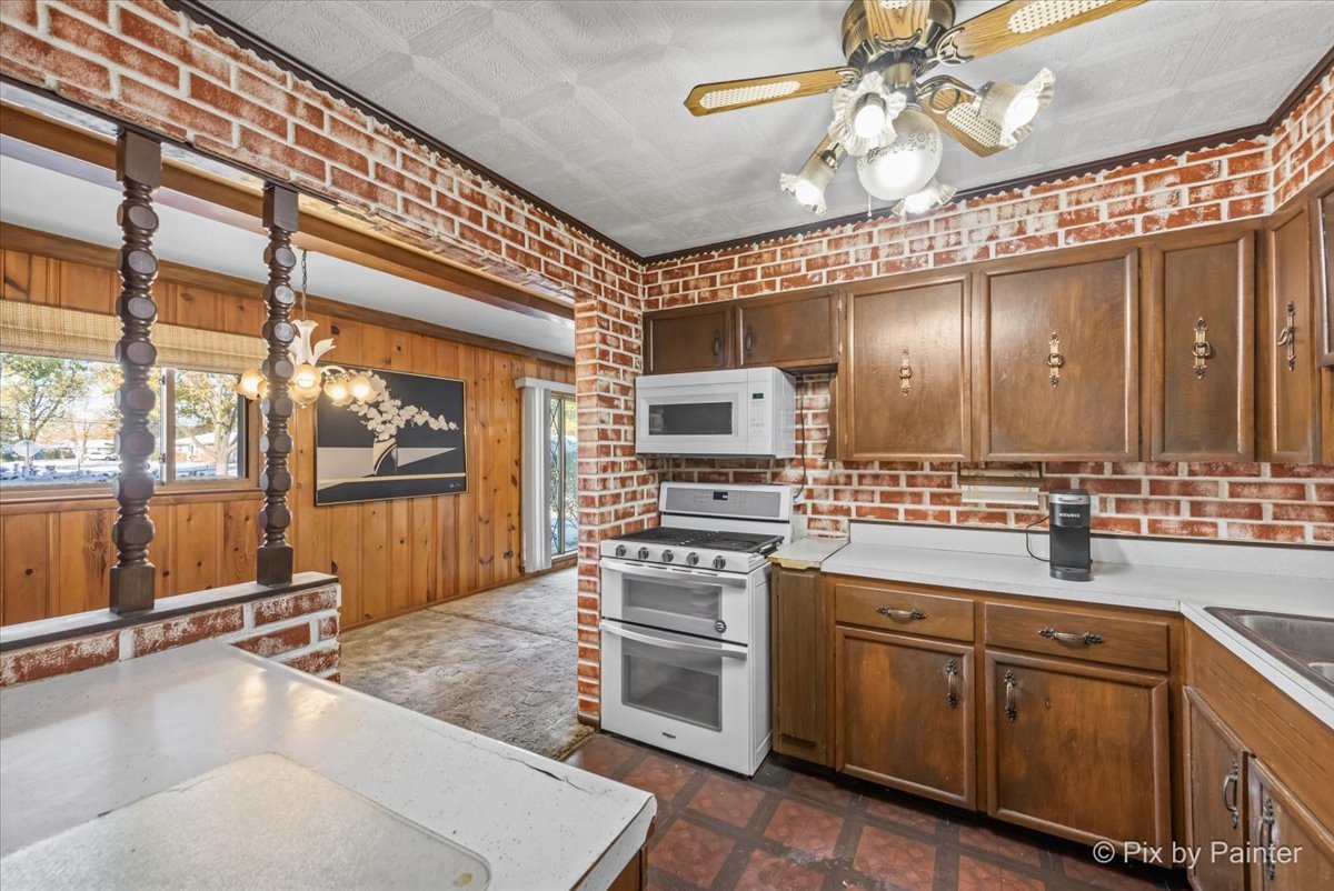 195 Washington Boulevard Hoffman Estates, IL 60169 - Photo 8 of 26 a kitchen with a sink appliances and cabinets