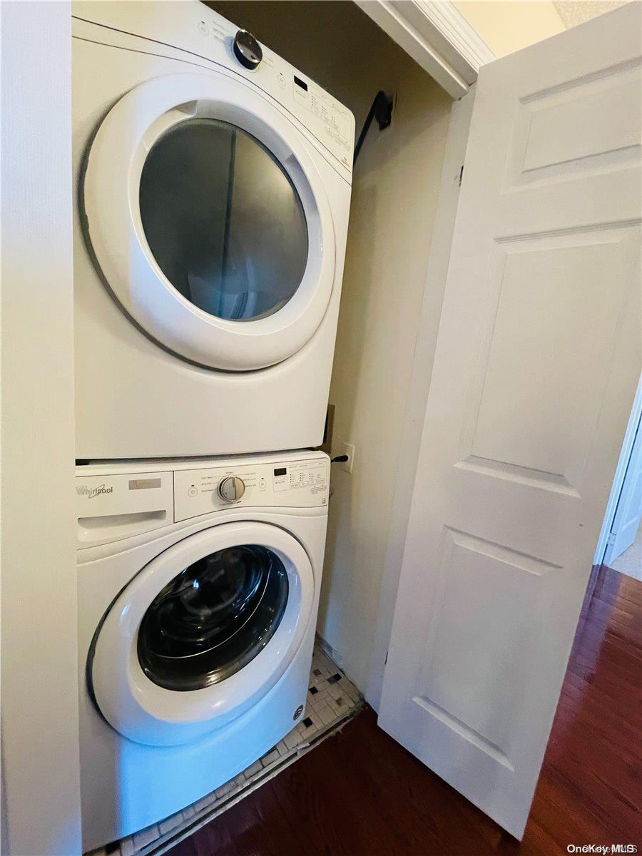 92-29 Queens Boulevard, Unit 9D Queens, NY 11374 - Photo 10 of 13 a utility room with dryer and washer