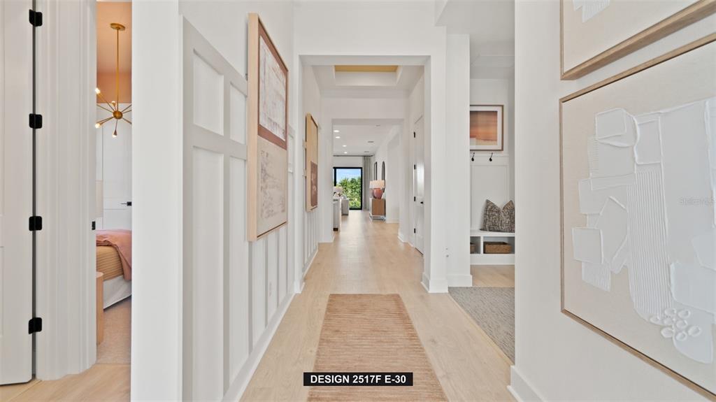 9531 Sandy Shores Street Parrish, FL 34219 - Photo 2 of 8 a view of a hallway with a white walls and stairs