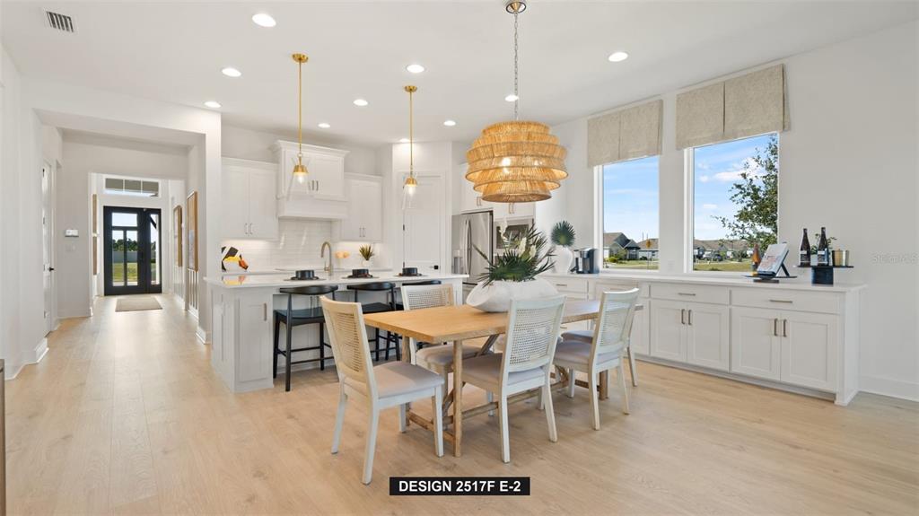 9531 Sandy Shores Street Parrish, FL 34219 - Photo 6 of 8 a large kitchen with a table and chairs