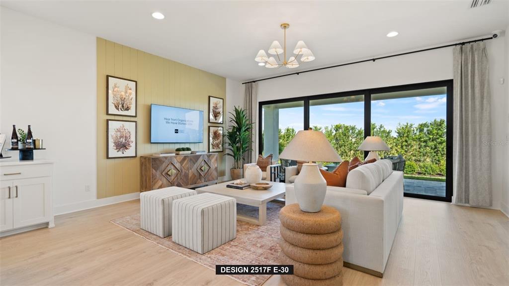 9531 Sandy Shores Street Parrish, FL 34219 - Photo 7 of 8 a living room with furniture and a large window