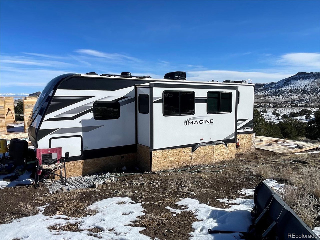 760 County Road East Del Norte, CO 81132 - Photo 11 of 20 a view of a terrace with a yard