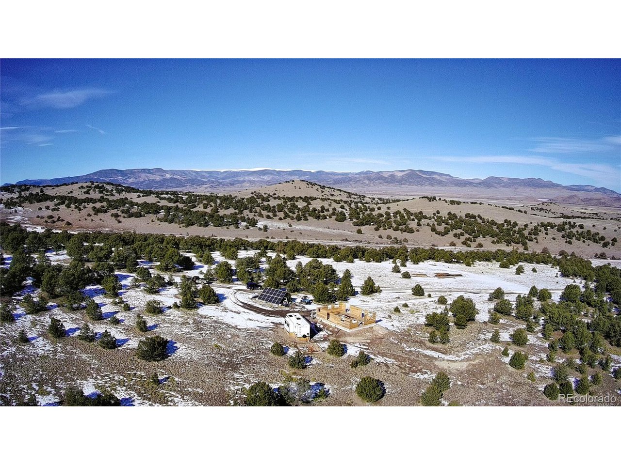 760 County Road East Del Norte, CO 81132 - Photo 20 of 20 a view of a city with mountains in the background