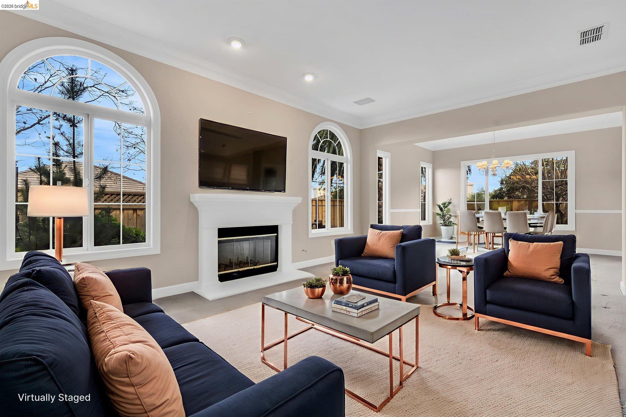 5 Circle E Ranch Place San Ramon, CA 94583 - Photo 13 of 60 a living room with furniture a flat screen tv and a fireplace