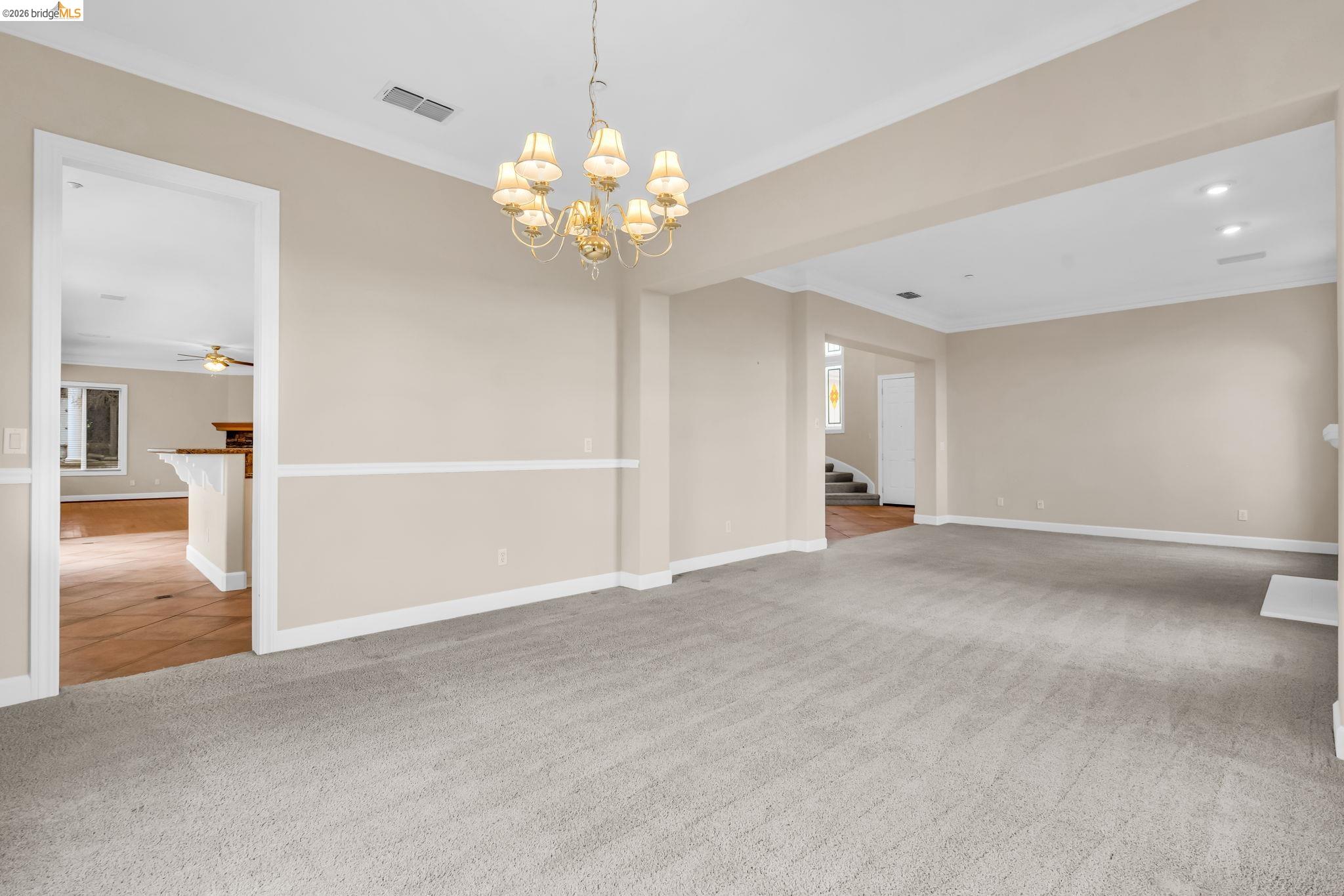 5 Circle E Ranch Place San Ramon, CA 94583 - Photo 16 of 60 a view of an empty room with a chandelier