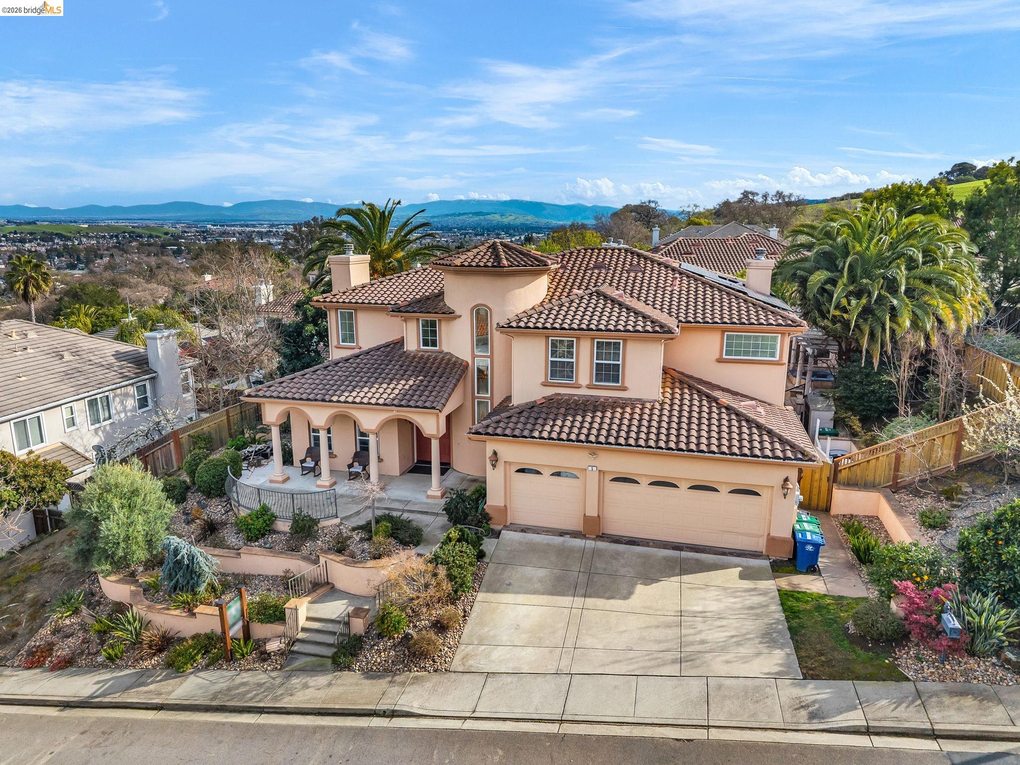 5 Circle E Ranch Place San Ramon, CA 94583 - Photo 2 of 60 Mediterranean / spanish-style home featuring a chimney, stucco siding, concrete driveway, a mountain view, and a tile roof