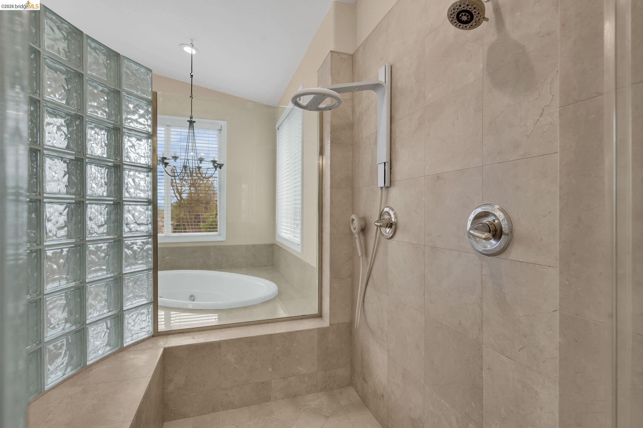 5 Circle E Ranch Place San Ramon, CA 94583 - Photo 22 of 60 a bathroom with a tub shower vanity and a sink