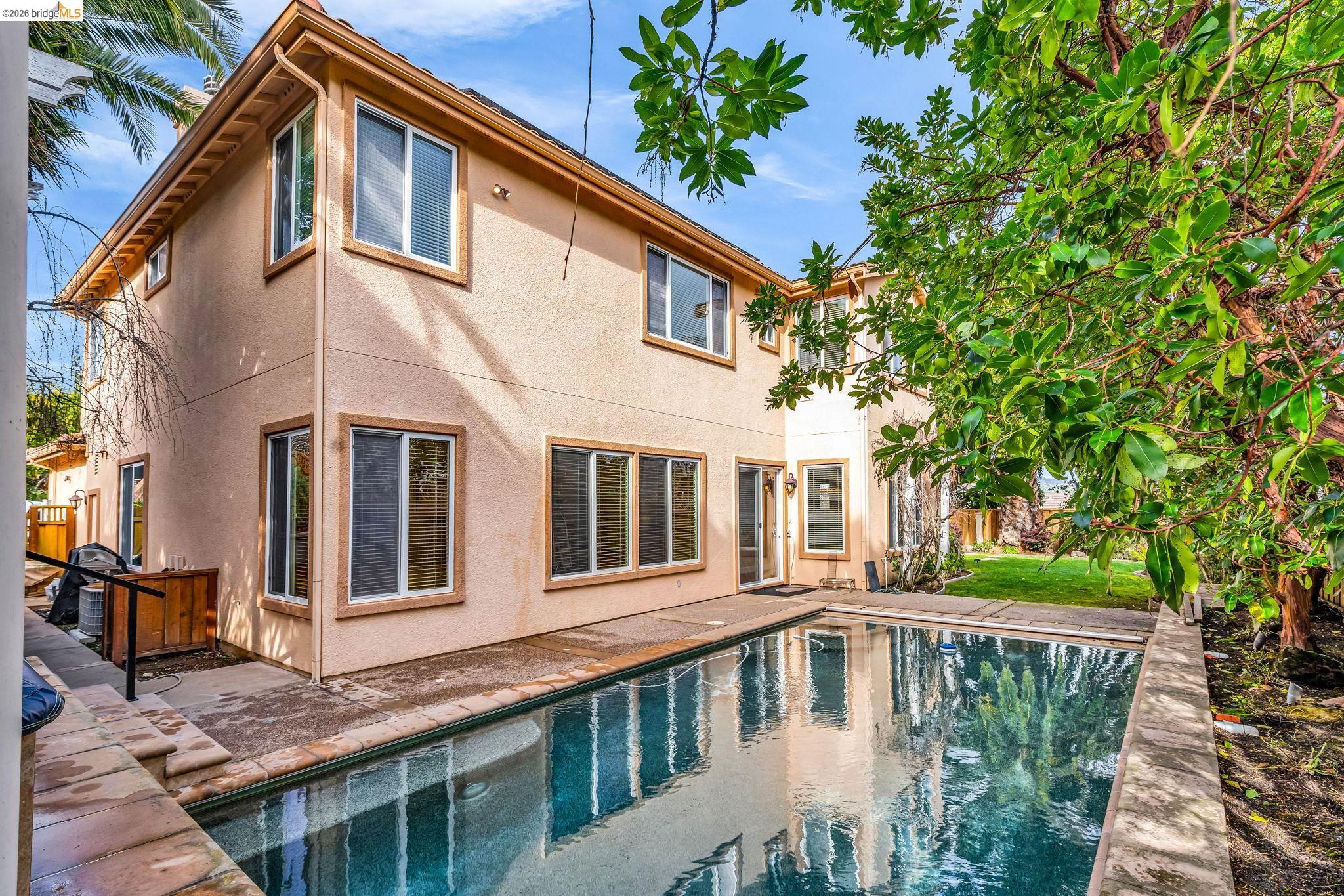 5 Circle E Ranch Place San Ramon, CA 94583 - Photo 26 of 60 Back of property with a patio area, an outdoor pool, and stucco siding