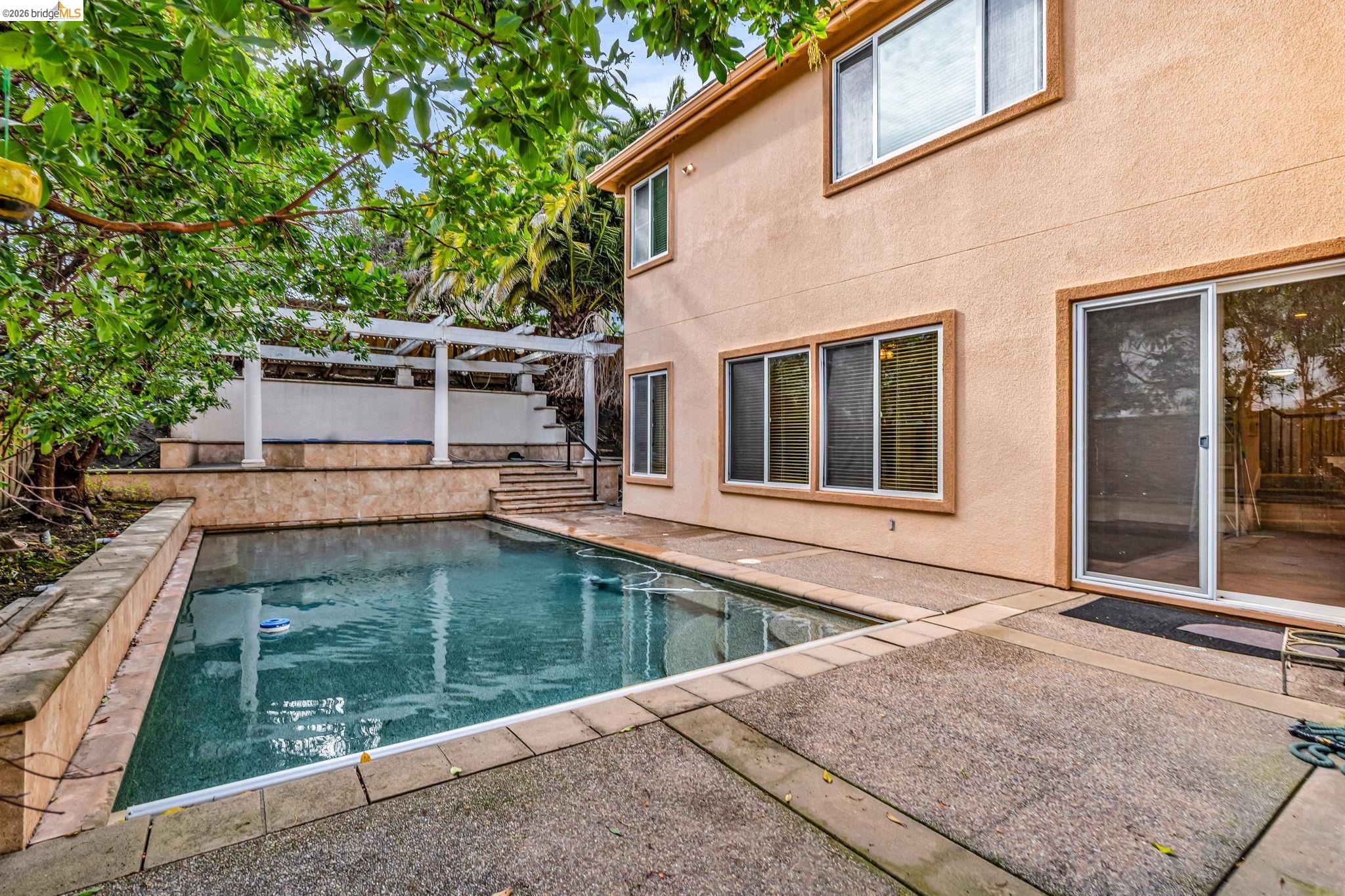 5 Circle E Ranch Place San Ramon, CA 94583 - Photo 28 of 60 View of swimming pool with patio surround, a pergola, and a fenced backyard