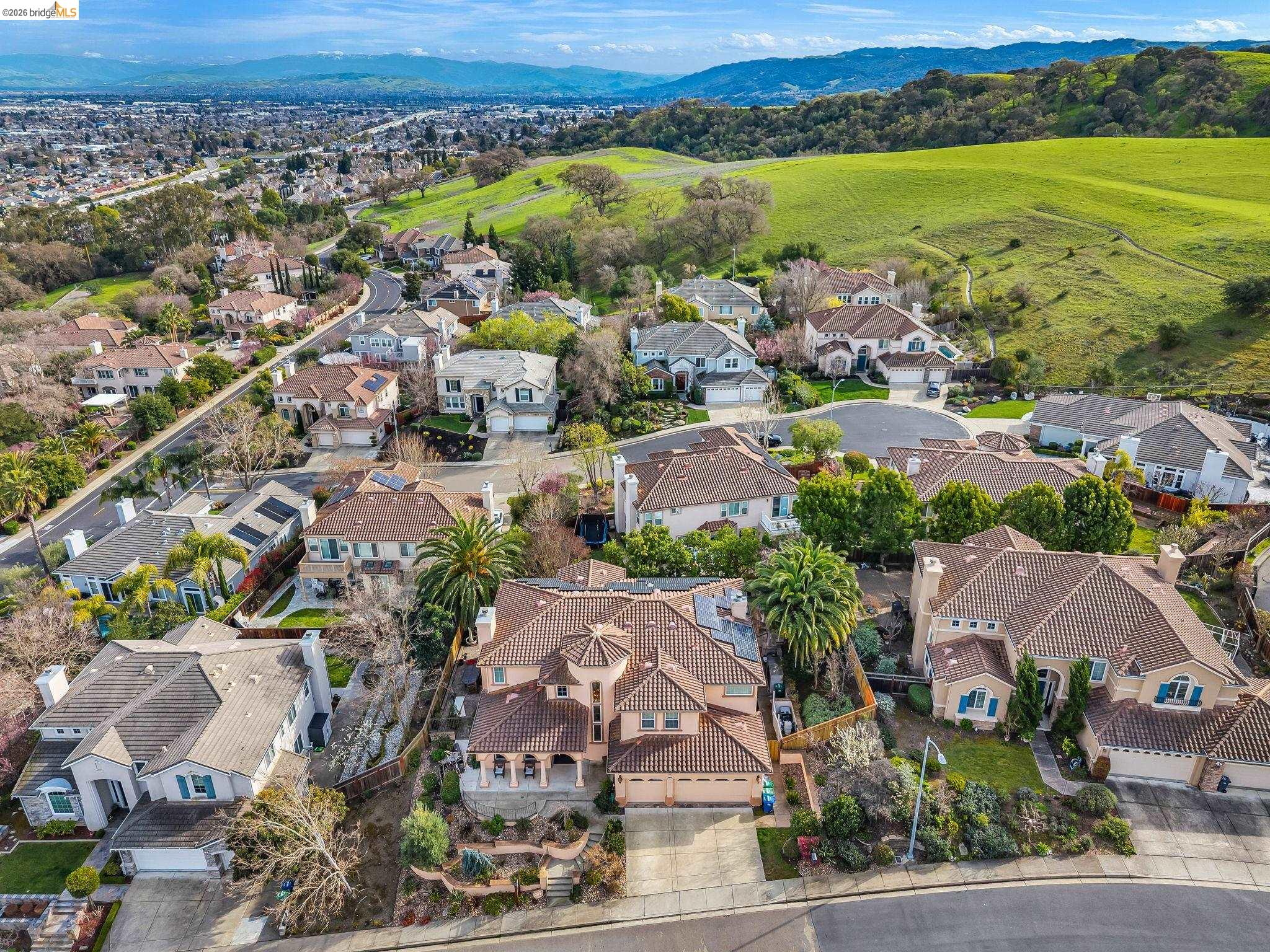 5 Circle E Ranch Place San Ramon, CA 94583 - Photo 3 of 60 an aerial view of a city with lots of residential buildings and mountain view in back
